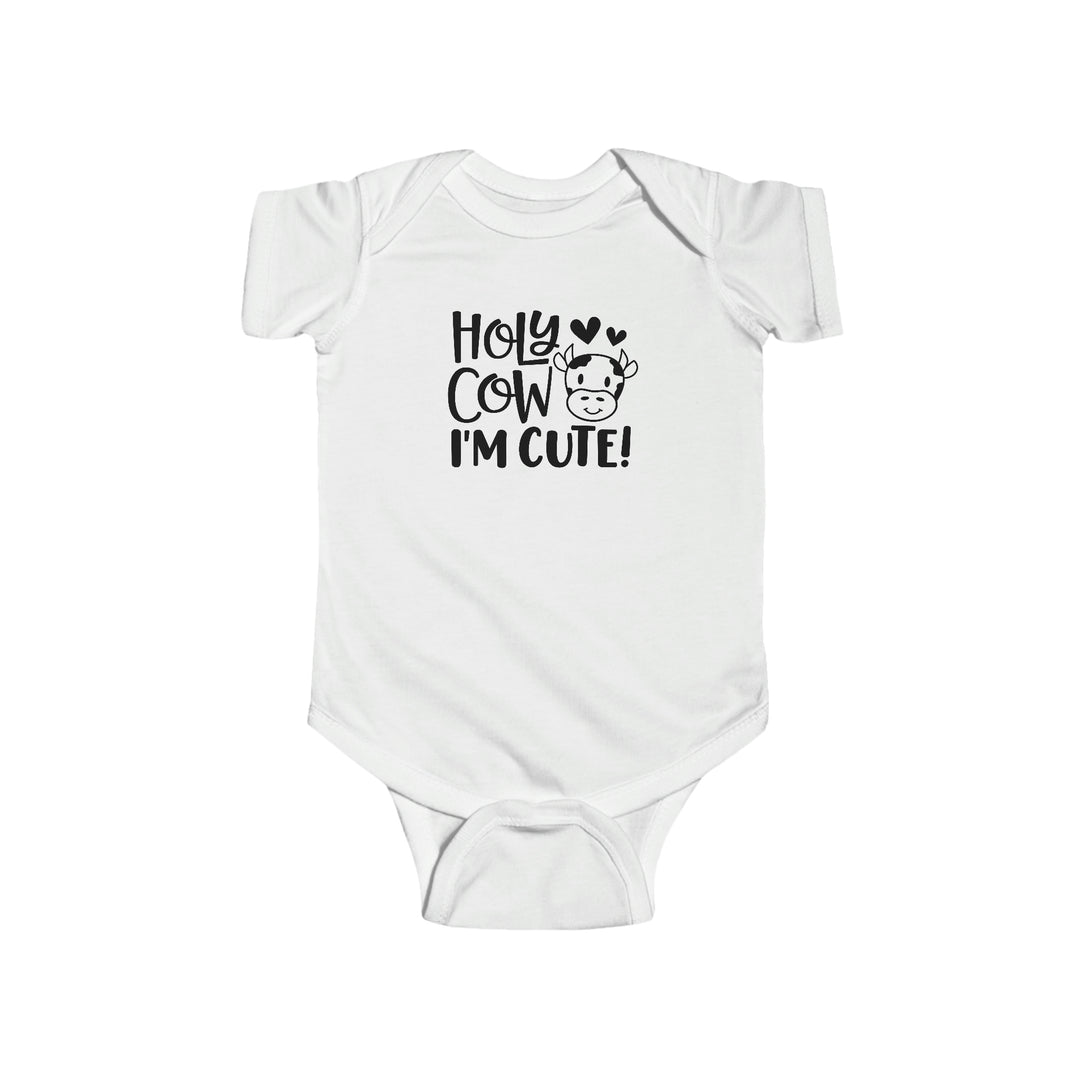 A white baby bodysuit with black text, featuring the product title Holy Cow I'm Cute Onesie from Worlds Worst Tees. Made of 100% cotton, durable seams, ribbed bindings, and plastic snaps for easy changing.