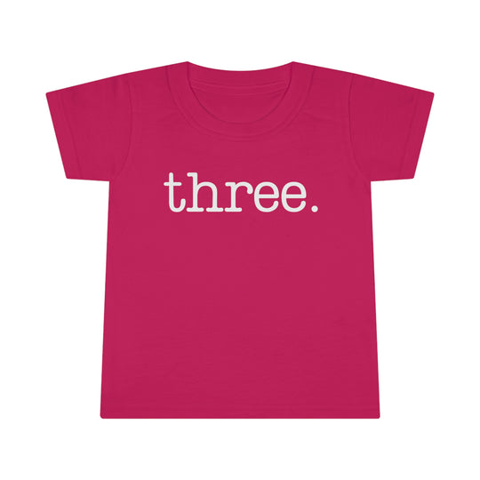 A durable Three Toddler Tee with a classic fit, high stitch density, and double-needle topstitched collar. Made of 100% Ringspun cotton, light fabric, perfect for kids.