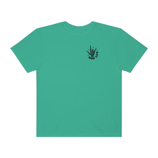 A green shirt with a hand print, part of the I Used to Be Cool Mom Tee collection at Worlds Worst Tees. Made of 100% ring-spun cotton, garment-dyed for coziness, with a relaxed fit and durable stitching.