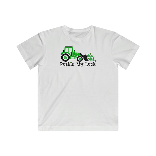 Pushin My Luck Kids Tee: White t-shirt featuring a tractor, clovers, and playful text. Soft, high-quality cotton, regular fit, ideal for kids. Sizes XS to XL. From Worlds Worst Tees.