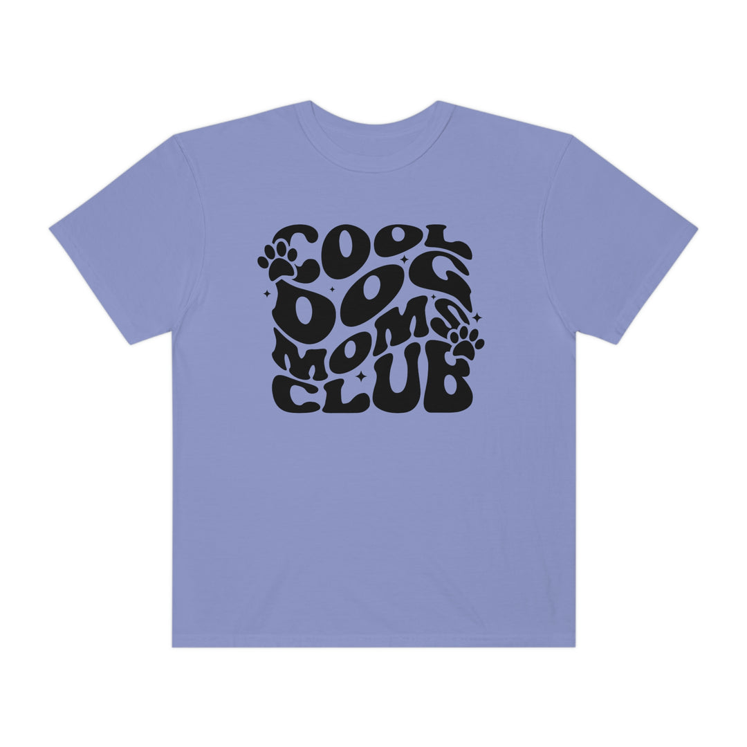 Cool Dog Mom's Club Tee: A black t-shirt featuring a paw print logo and text, made of 100% ring-spun cotton for a cozy feel. Relaxed fit with double-needle stitching for durability.
