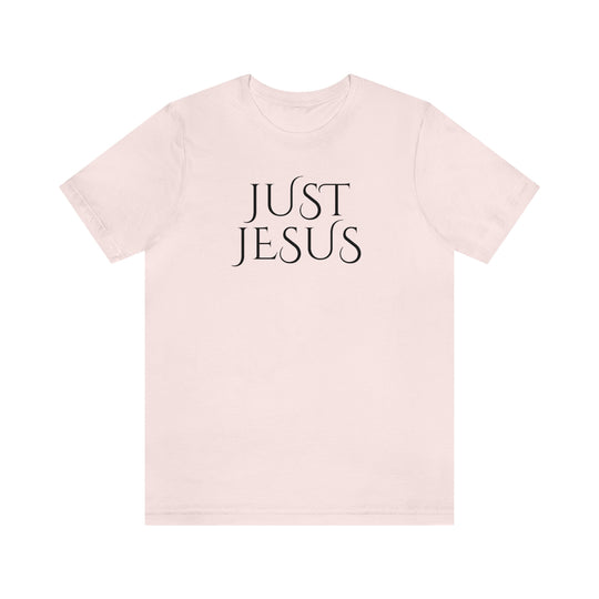 A beloved Just Jesus Tee in white with black text, featuring ribbed knit collars and taping on shoulders for lasting fit. Made of 100% Airlume combed cotton, with a retail fit.