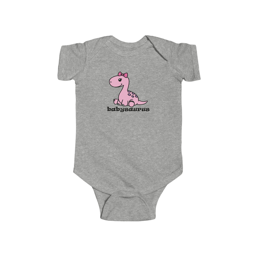A grey baby bodysuit featuring a pink dinosaur cartoon, ideal for infants. Made of soft, durable 100% cotton fabric with ribbed knit bindings and plastic snap closures for easy changing. From 'Worlds Worst Tees'.