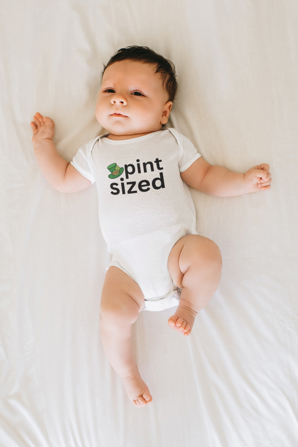 Pint Sized Onesie: Infant fine jersey bodysuit in 100% cotton, featuring ribbed bindings for durability and plastic snaps for easy changes. Combed ringspun cotton, light fabric, tear away label. Toddler clothing essential.